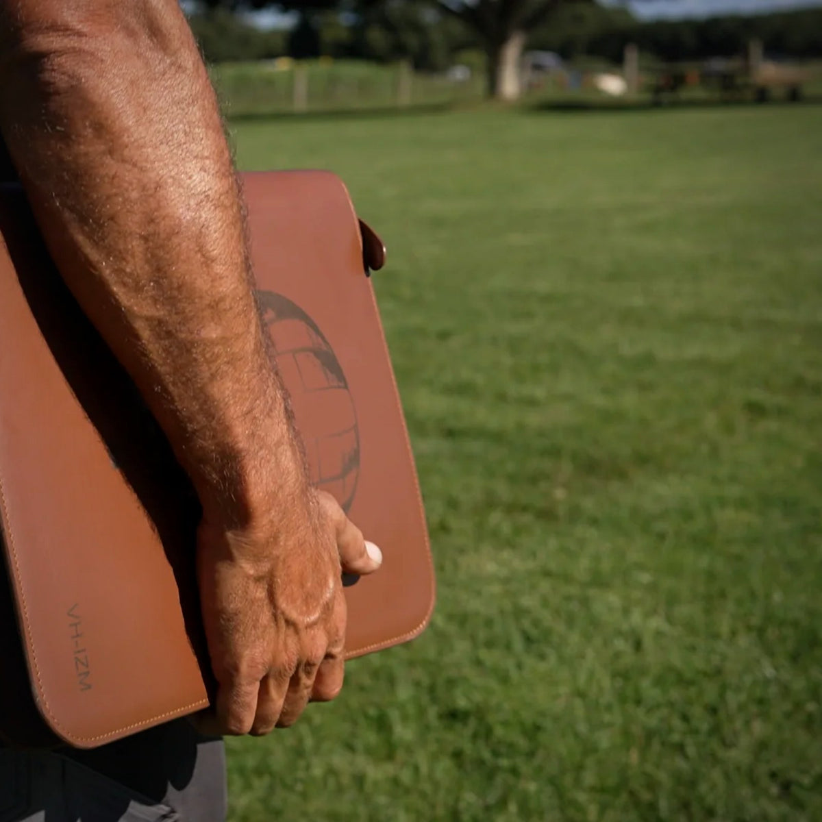 Carrying the closed Trade Hub leather work folder