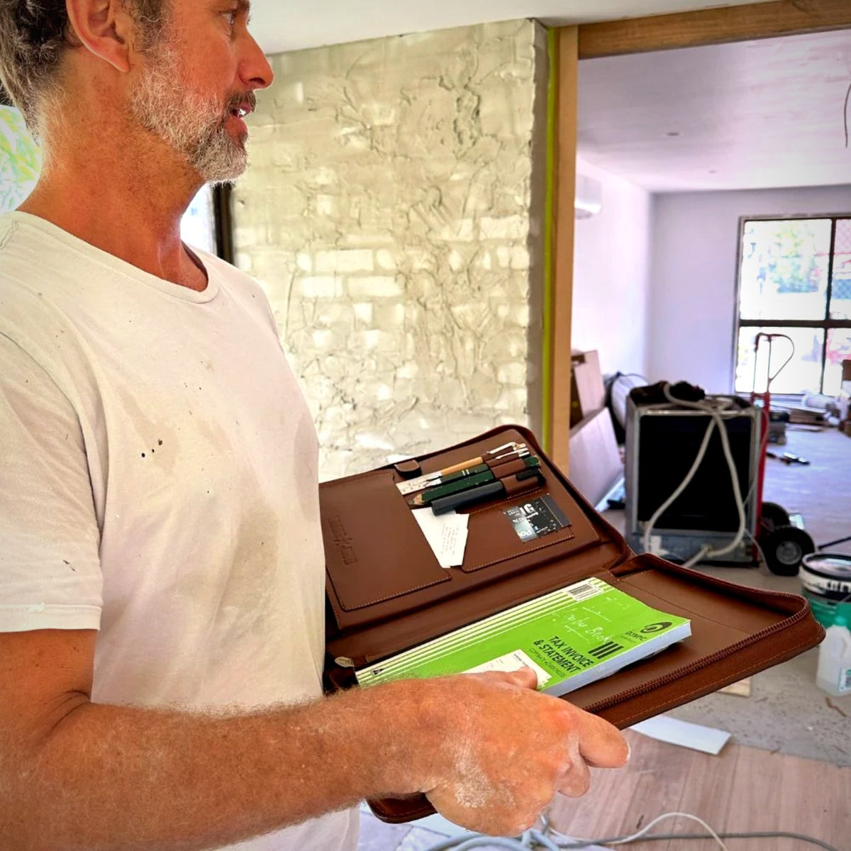 Tradie using the Trade Hub work folder on a renovation site